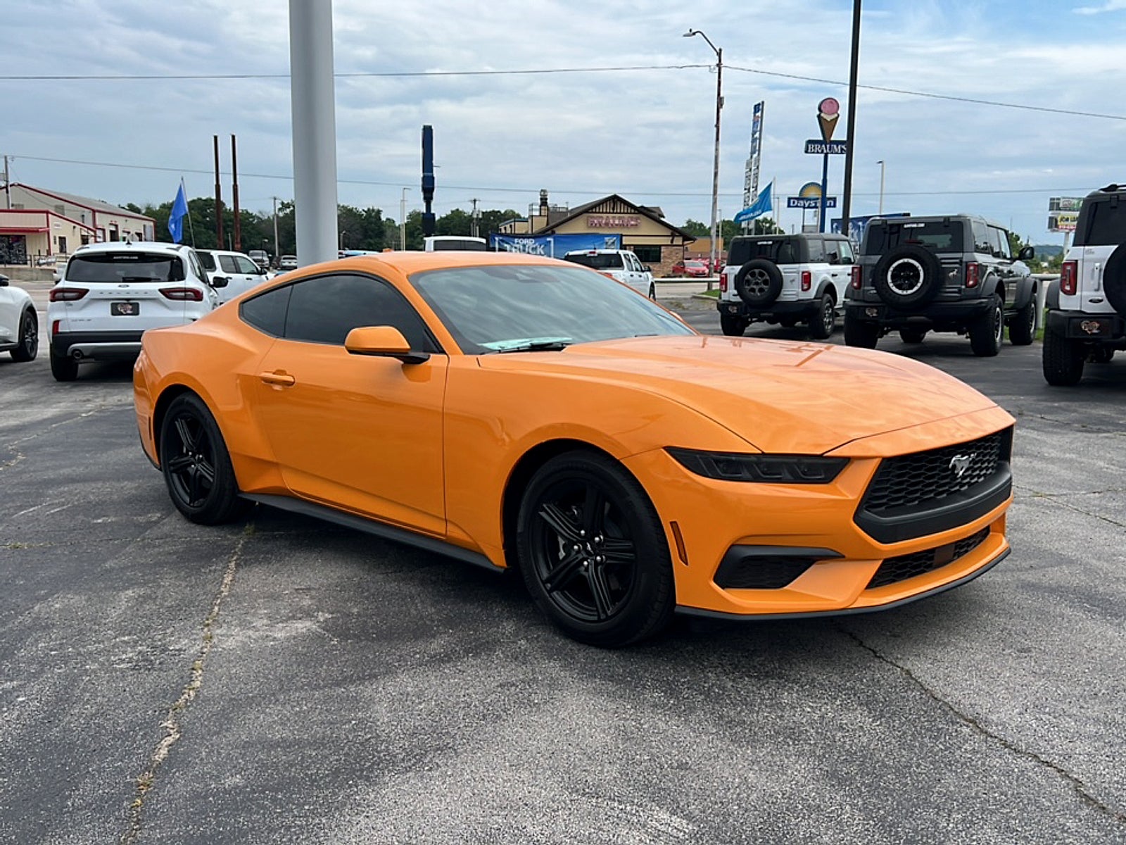 2026 Ford Mustang EcoBoost Fastback in Orange Fury Metallic Tri-Coat — front three-quarter view