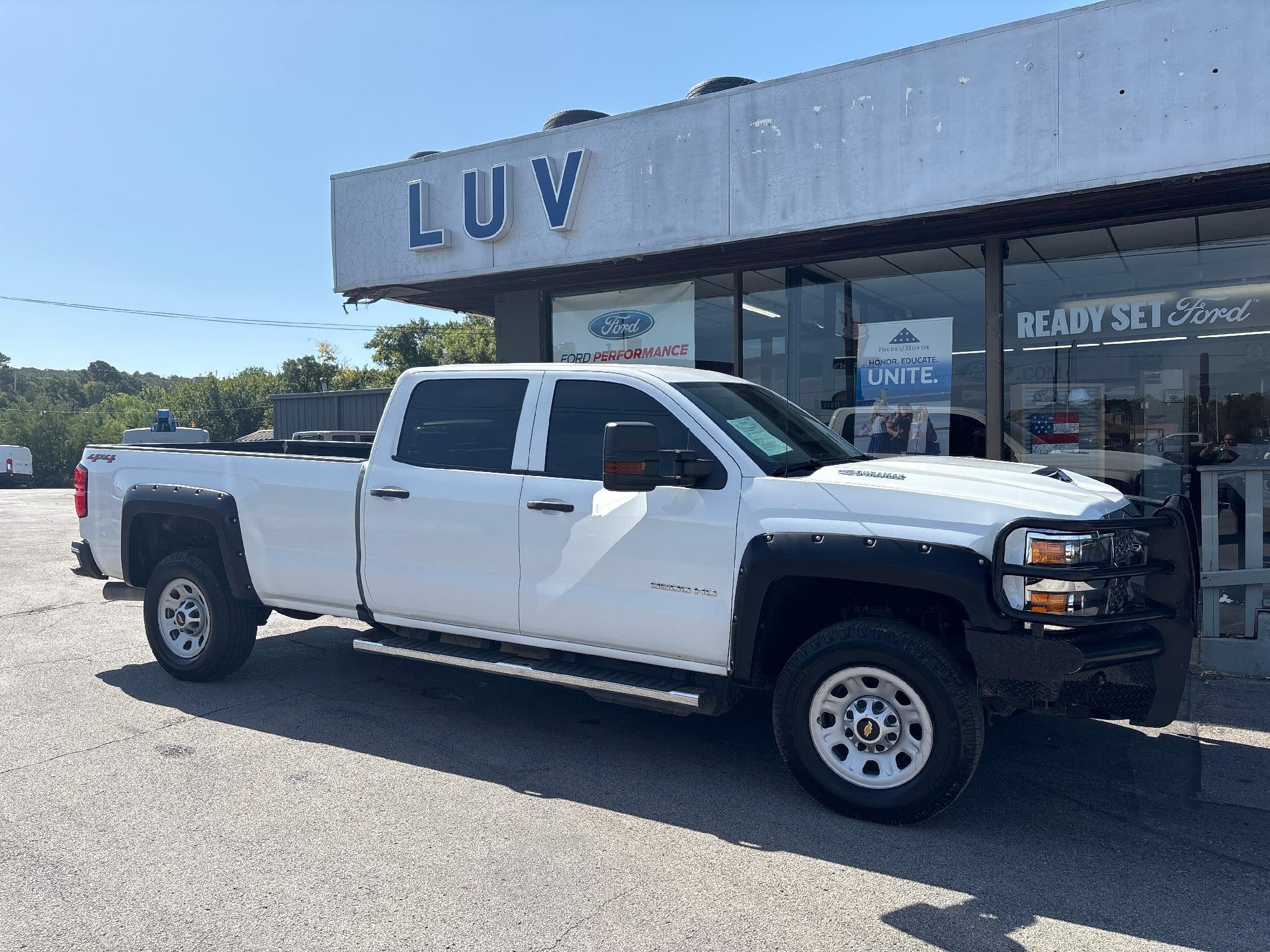 2019 Chevrolet Silverado 3500 HD Crew Cab Long Box 4-Wheel Drive Work Truck in Summit White — front three-quarter view