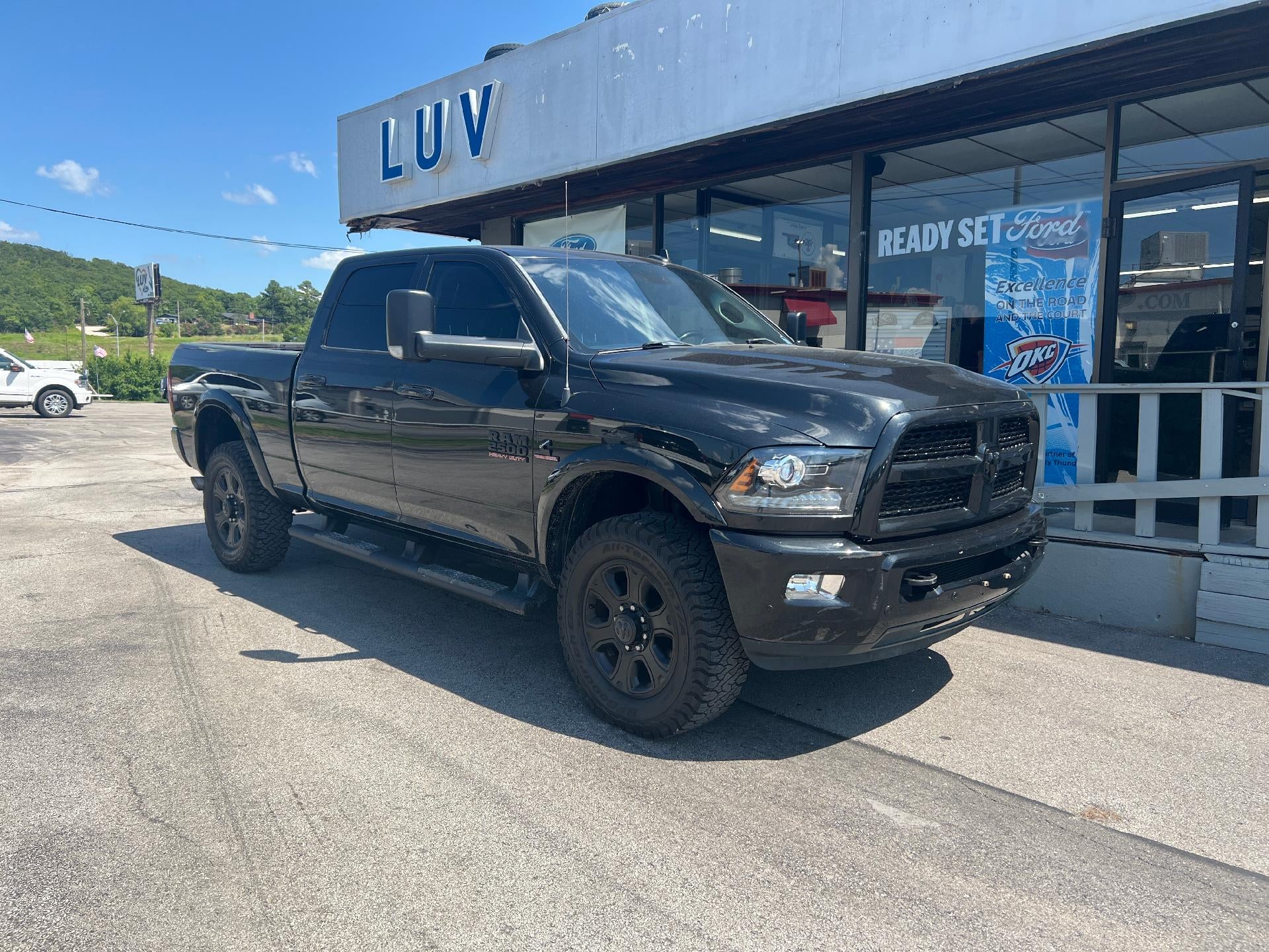 2017 RAM 2500 Laramie 4x4 Crew Cab 6'4" Box in Black — front three-quarter view