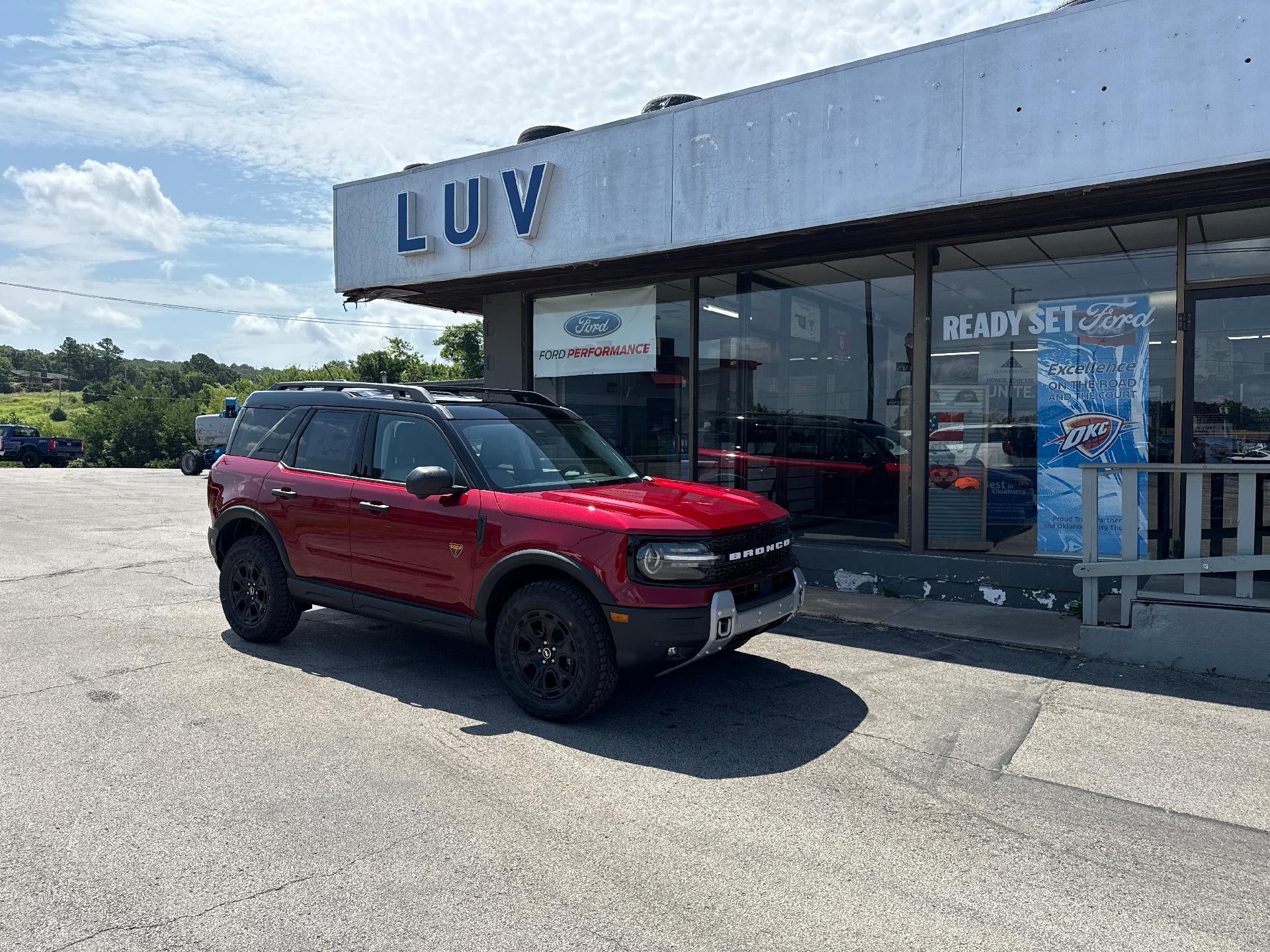 2026 Ford Bronco Sport Badlands 4x4 in Ruby Red Metallic Tinted Clearcoat — front three-quarter view
