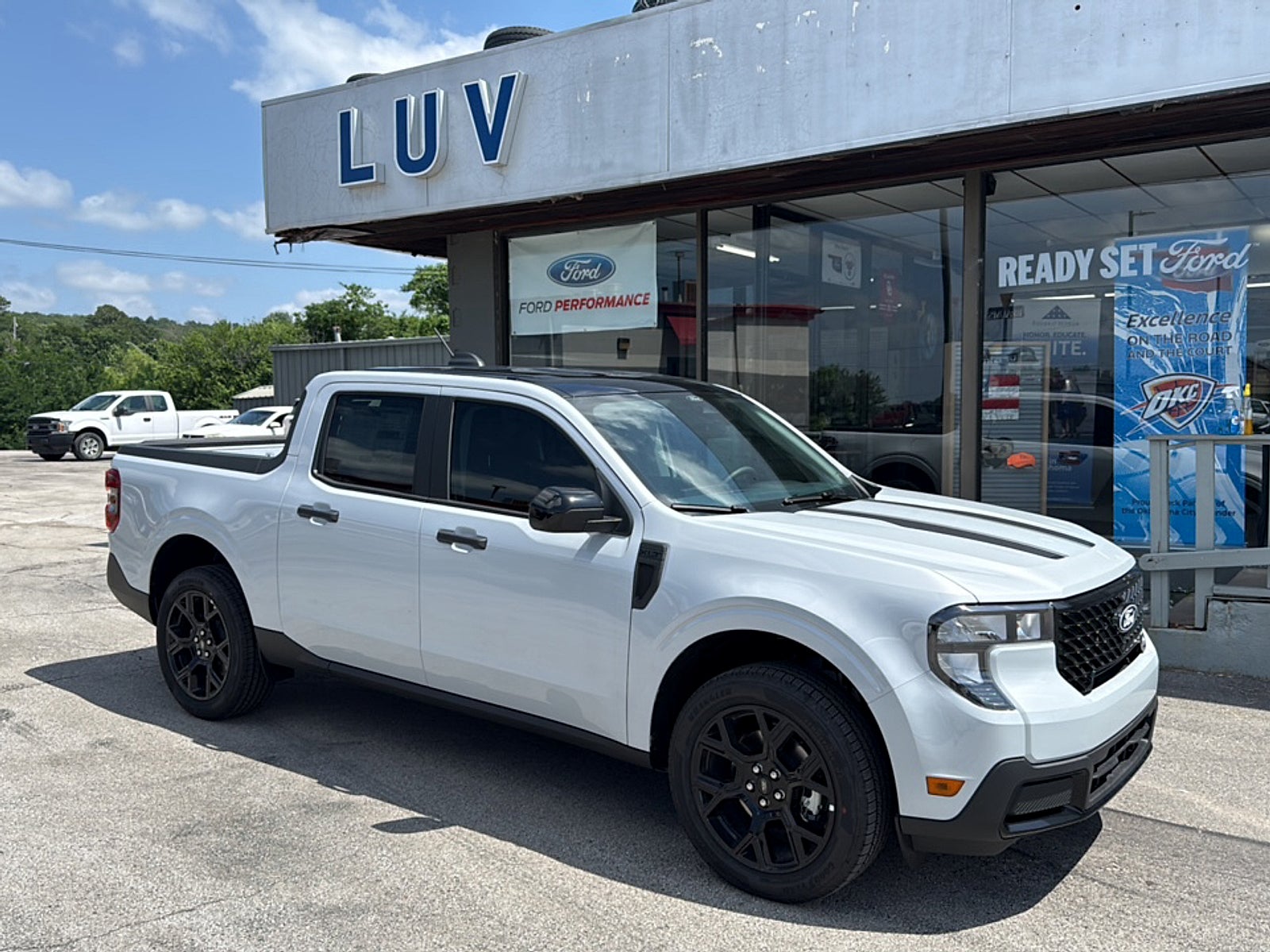 2026 Ford Maverick XLT AWD SuperCrew in Space White Mettalic — front three-quarter view