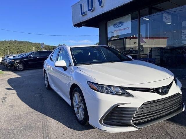 2024 Toyota Camry LE Auto (SE) in Midnight Black Metallic — front three-quarter view